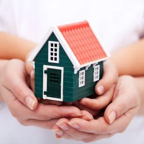 a mother and child holding a miniture house