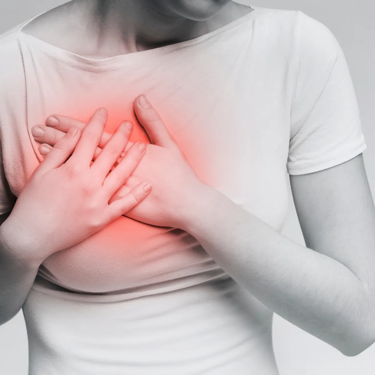Woman standing with arms open in a moment of relief and emotional wellness