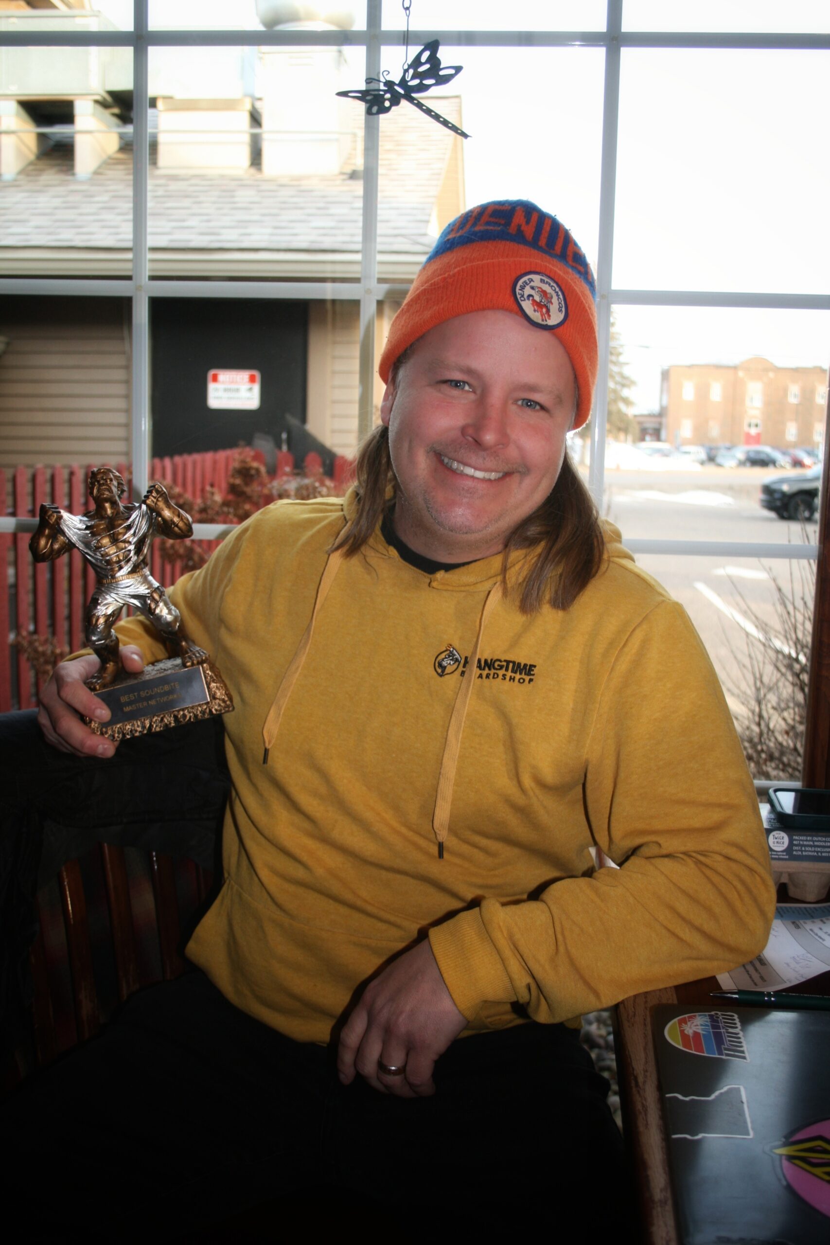 Owner of AB CAM Services, Adam Bonine, standing in front of a service van