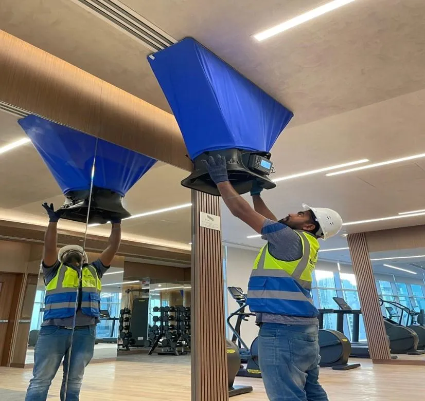 Luna HVAC technician performing an air duct inspection and balancing service in a Marina, CA residence.