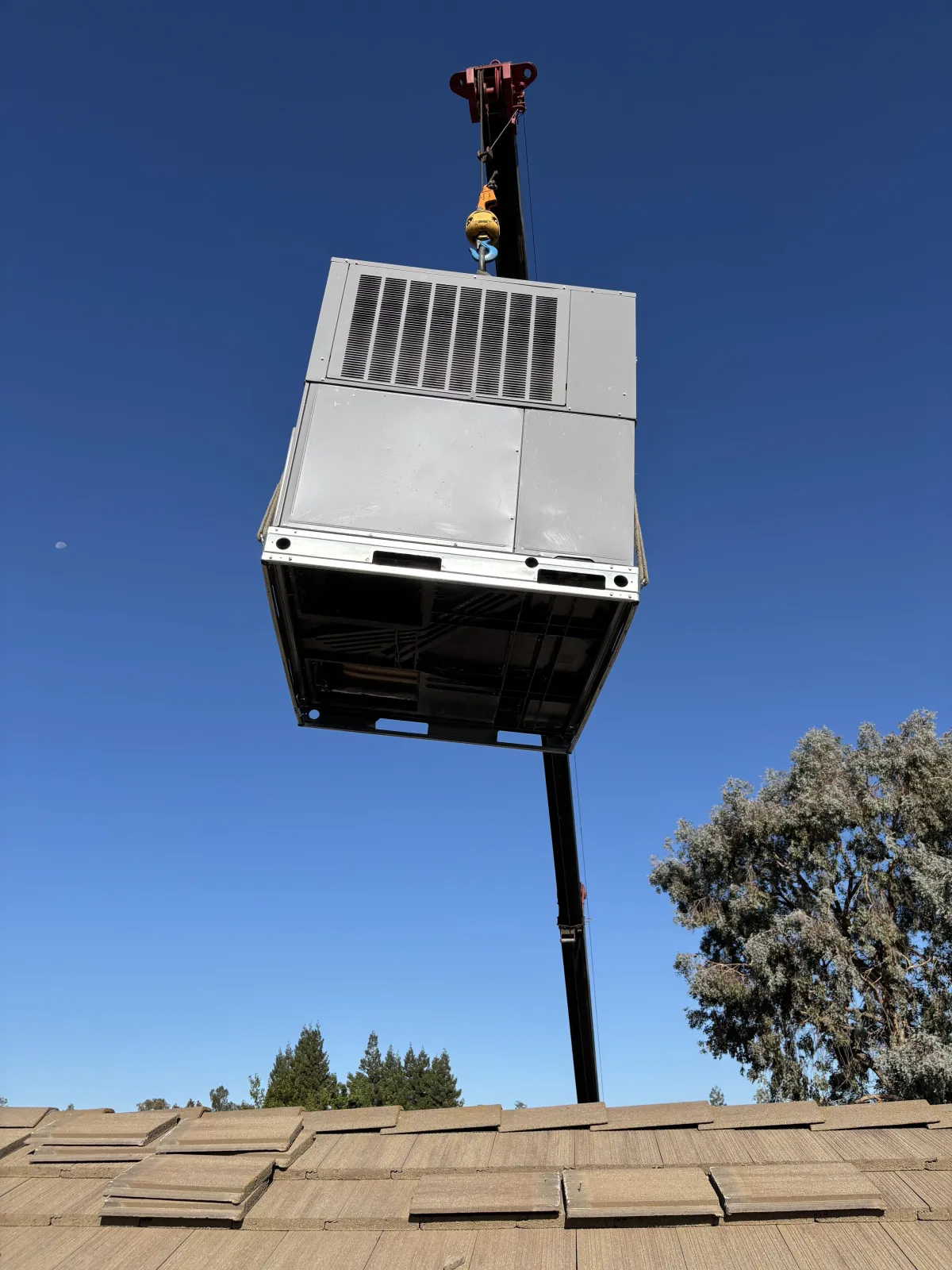 Certified Luna HVAC technician performing a residential AC system diagnostic and maintenance check in Marina, CA.