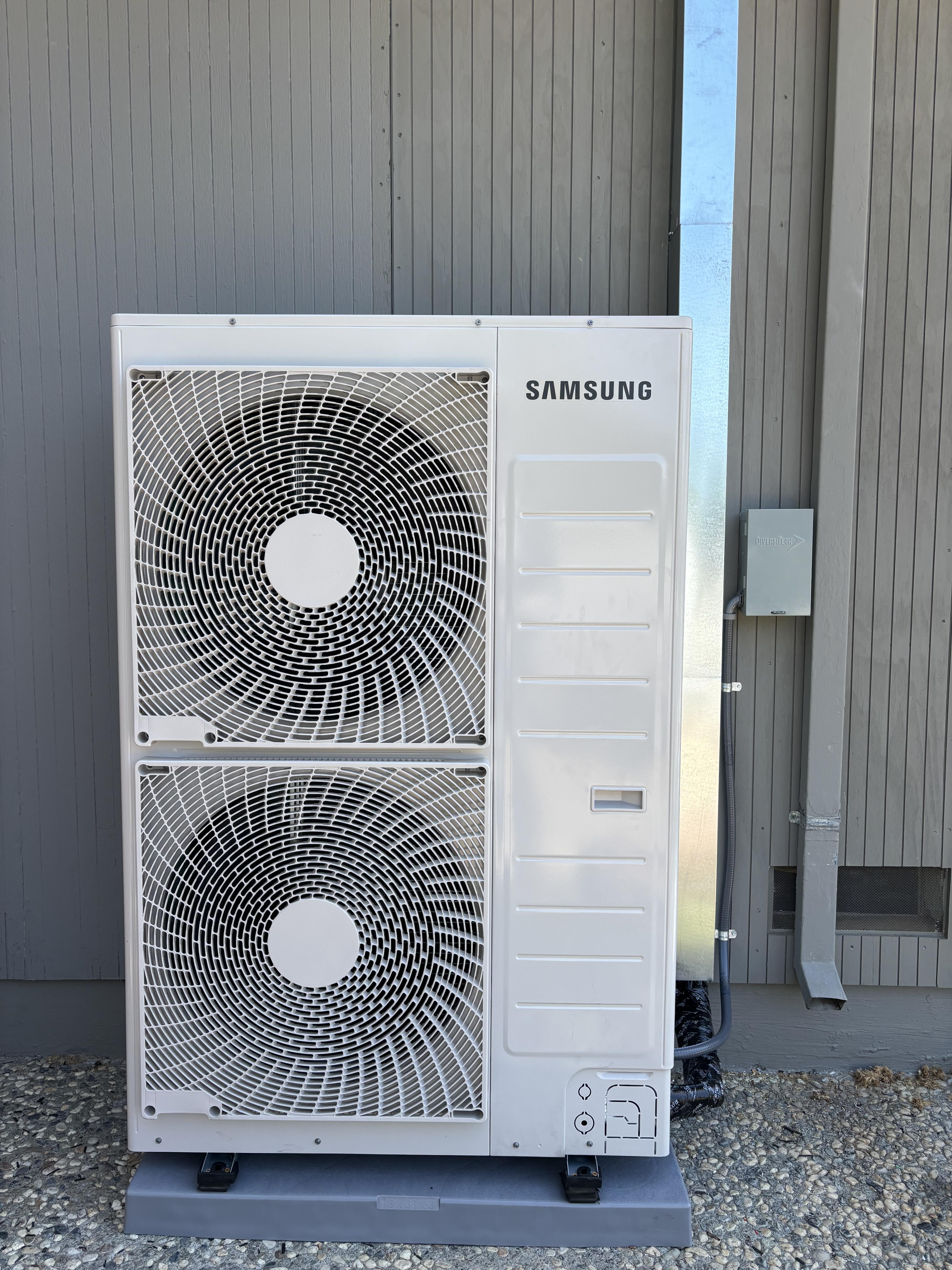 Certified Luna HVAC technician performing a residential AC system diagnostic and maintenance check in Marina, CA.