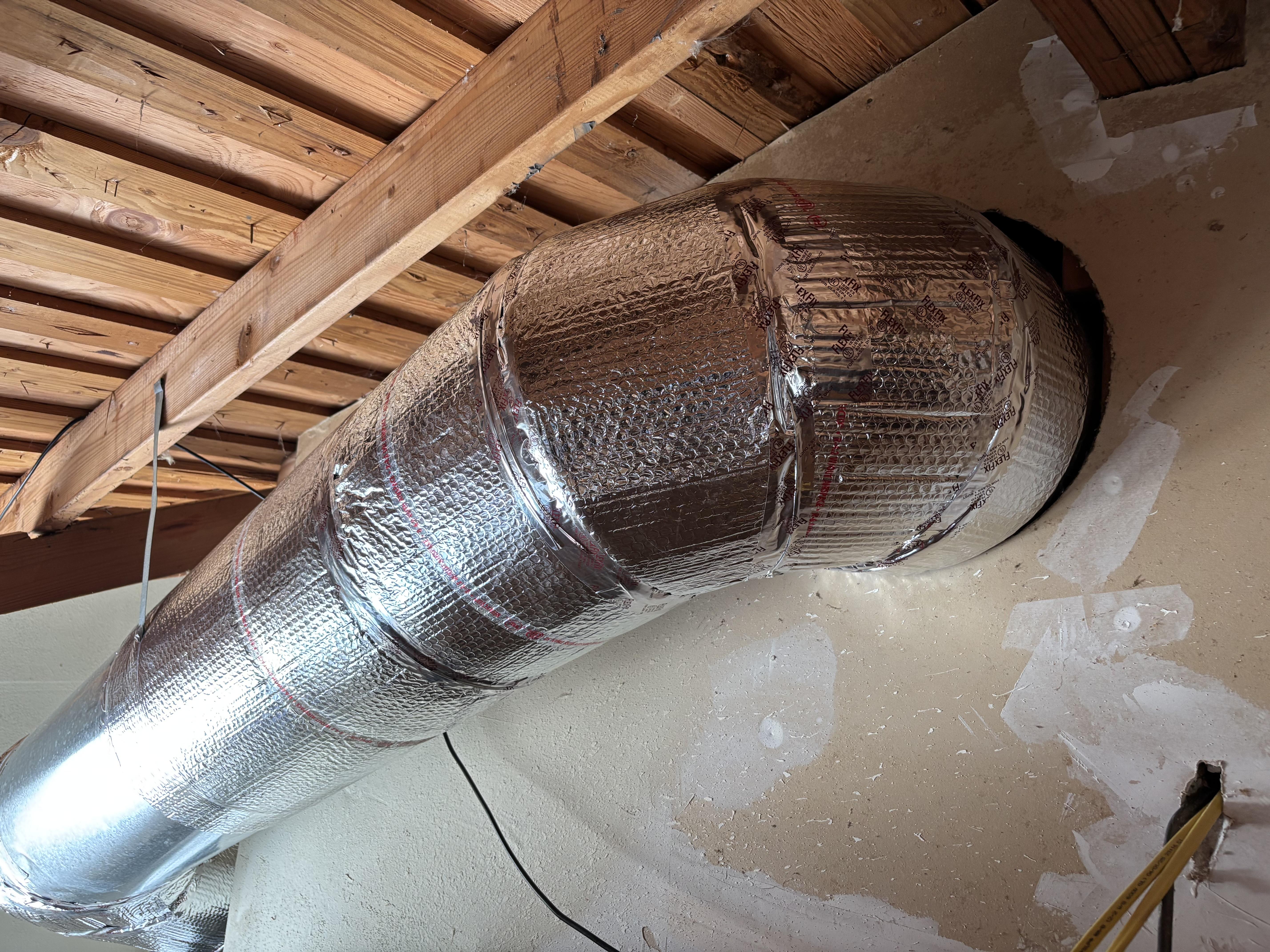 Luna HVAC technician performing an air duct inspection and balancing service in a Marina, CA residence.