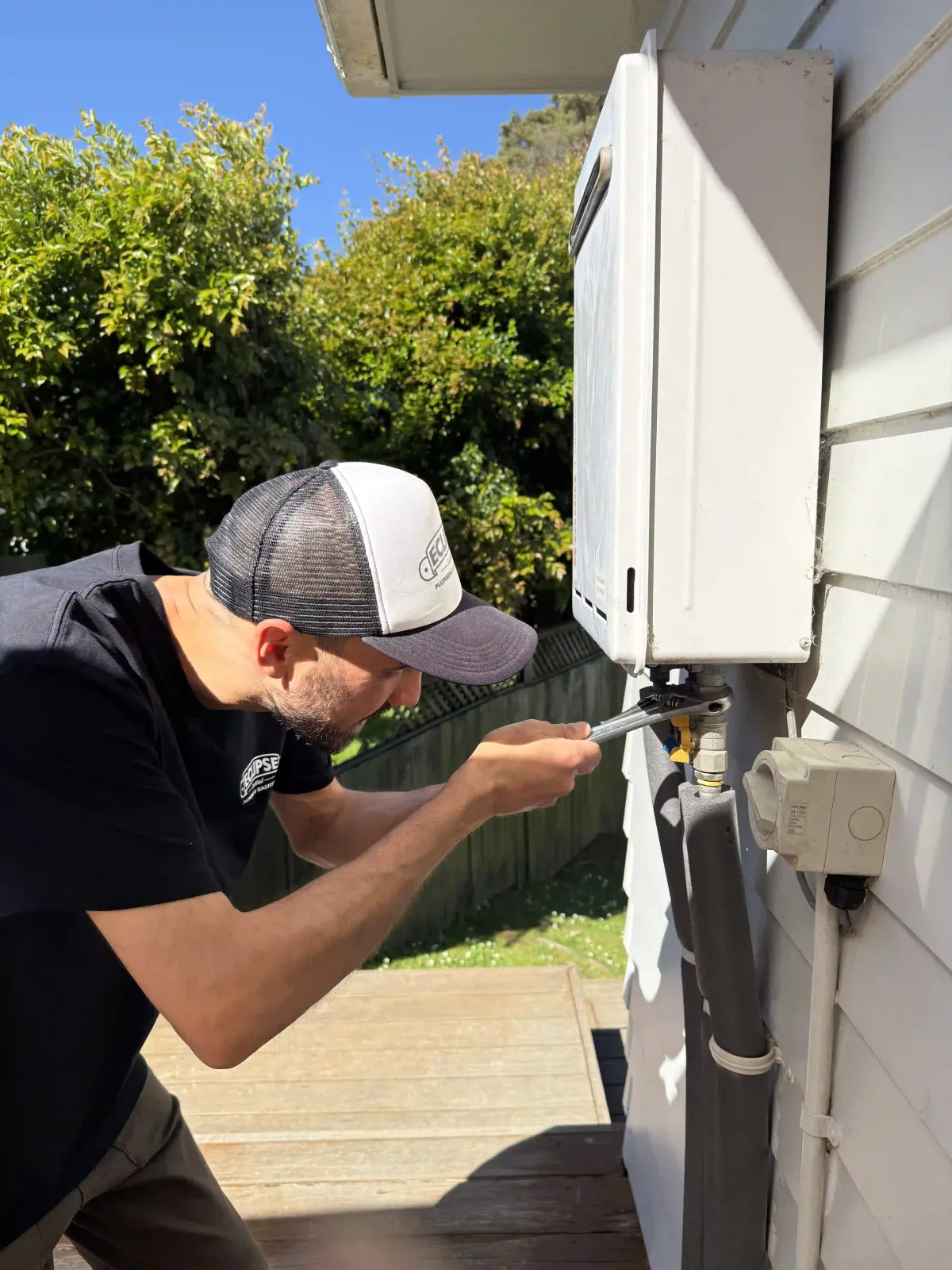 Plumber working on Continuous Flow Gas Hot Water in a Birkdale home