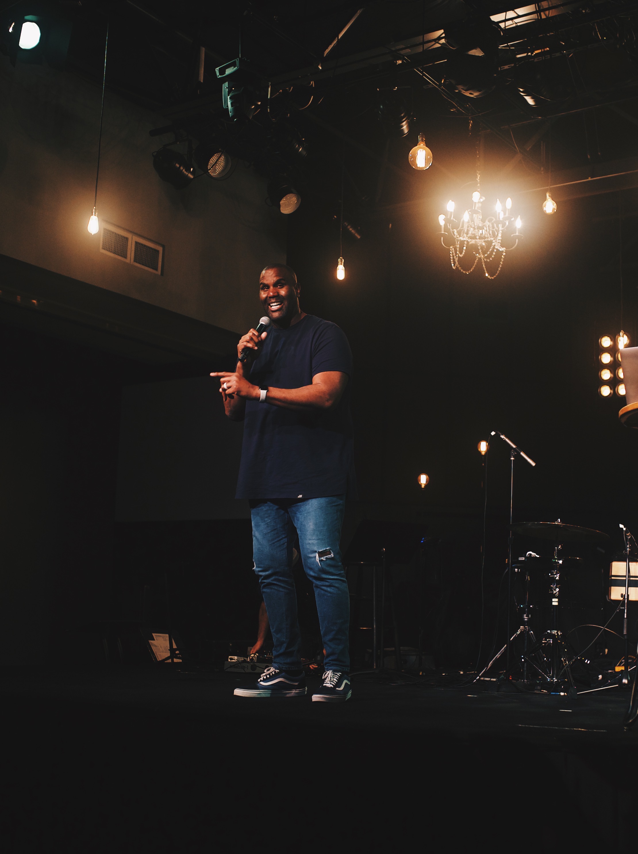 Speaker on stage at a leadership event