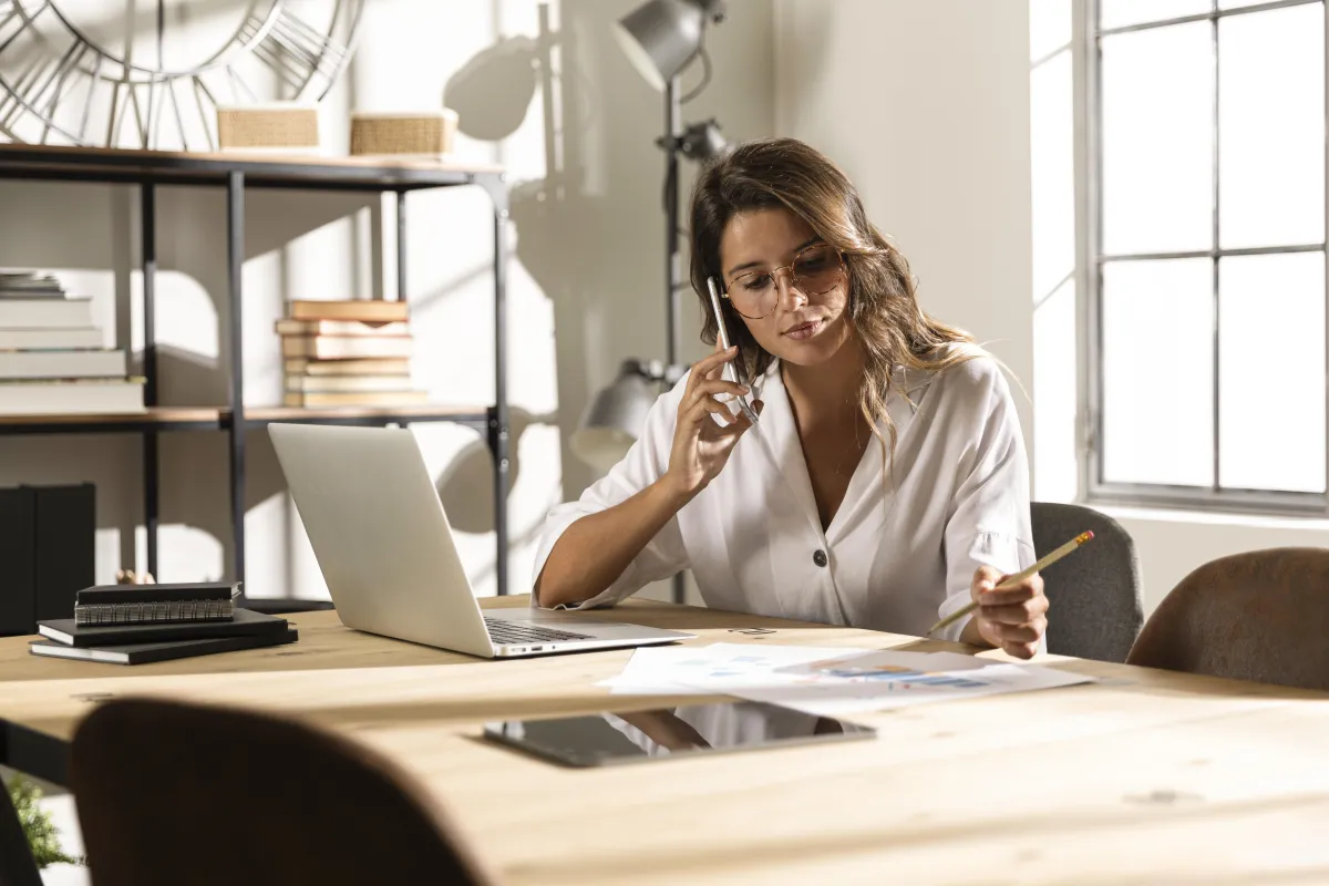 Successful woman in home office working on her legal funding company