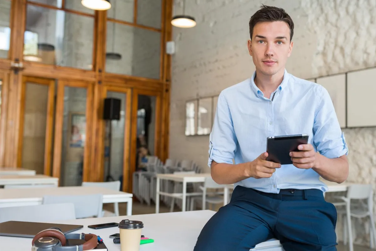 Confident young man building is legal funding business at co working space