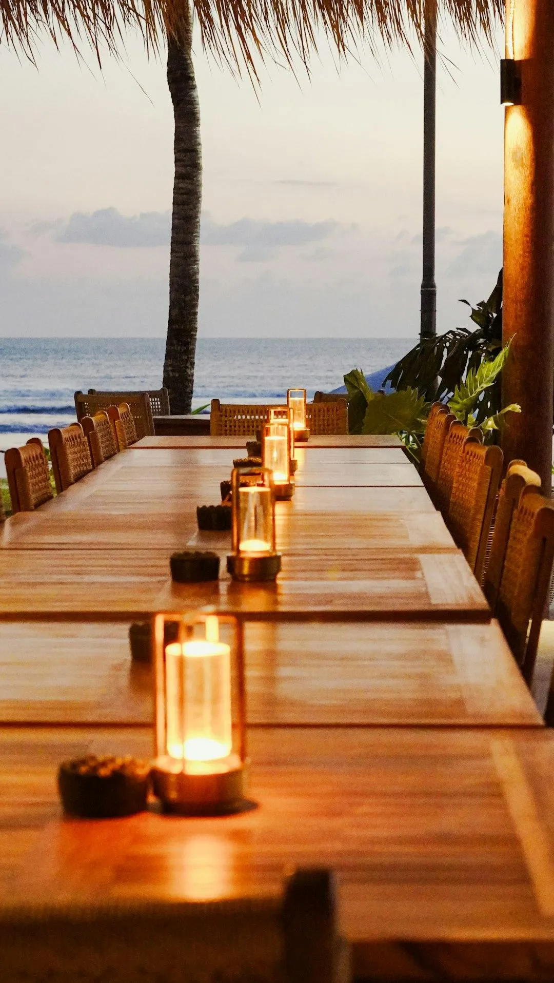 a view of a beach from private dining space in a restaurant