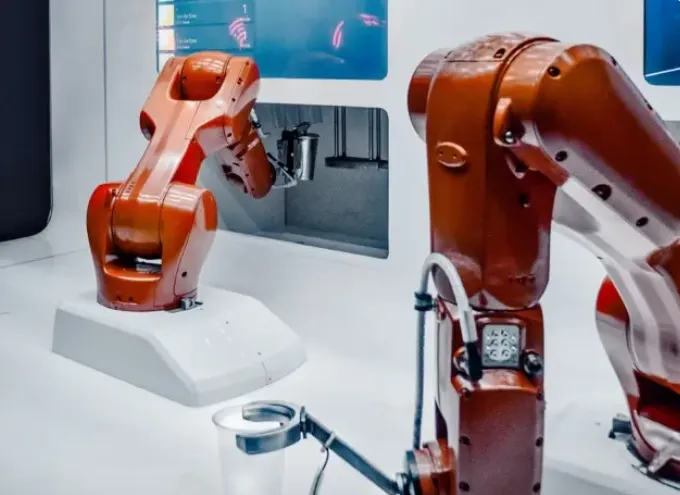 Close up of an orange industrial robotic arm