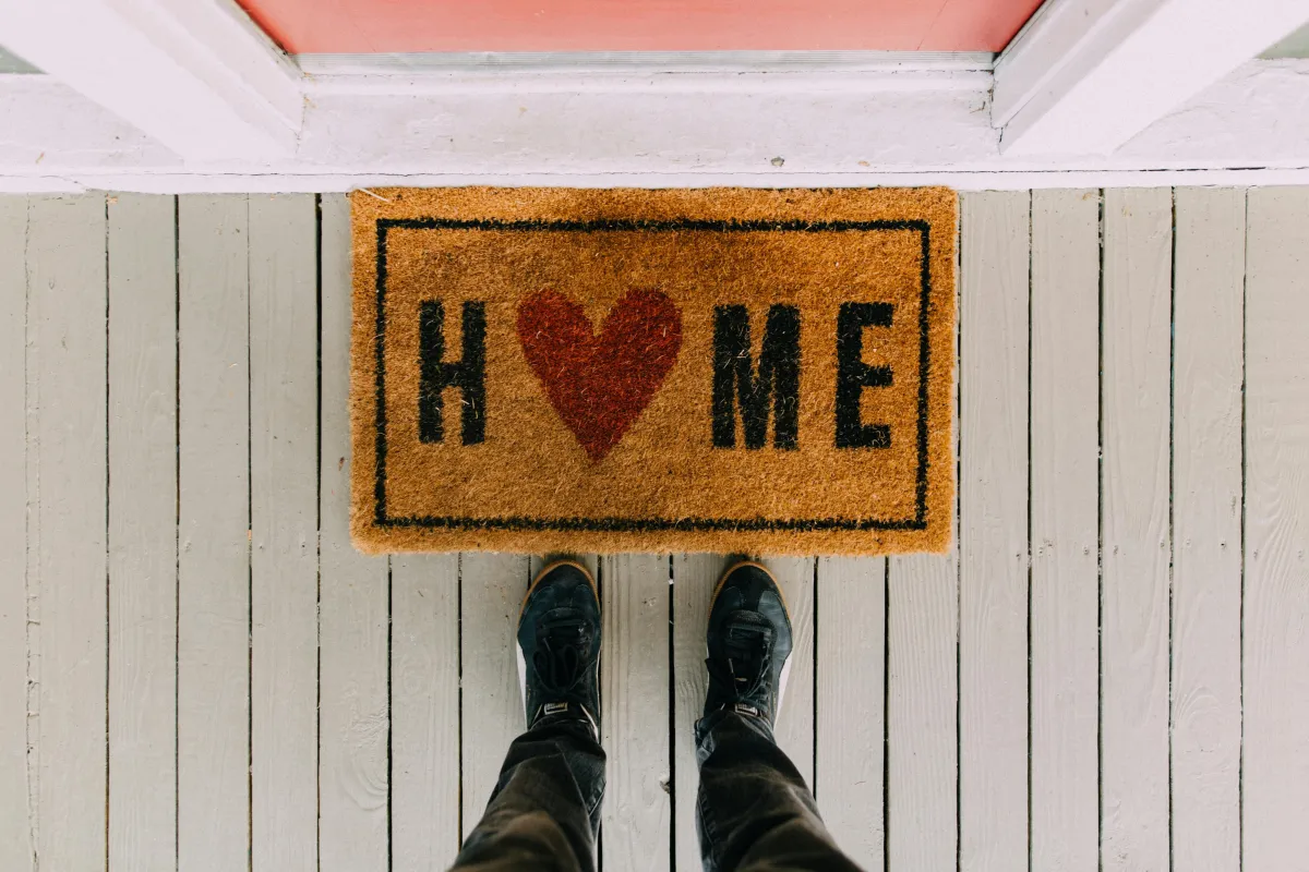 Front doormat that says HOME