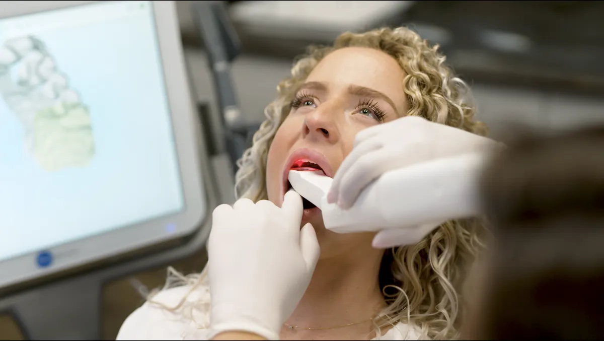 Blonde Orthodontist Patient Teeth Scan