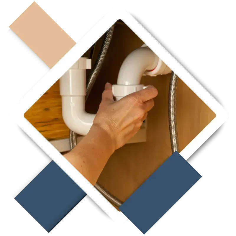 Skilled handyman repairing a leaky faucet for home maintenance.