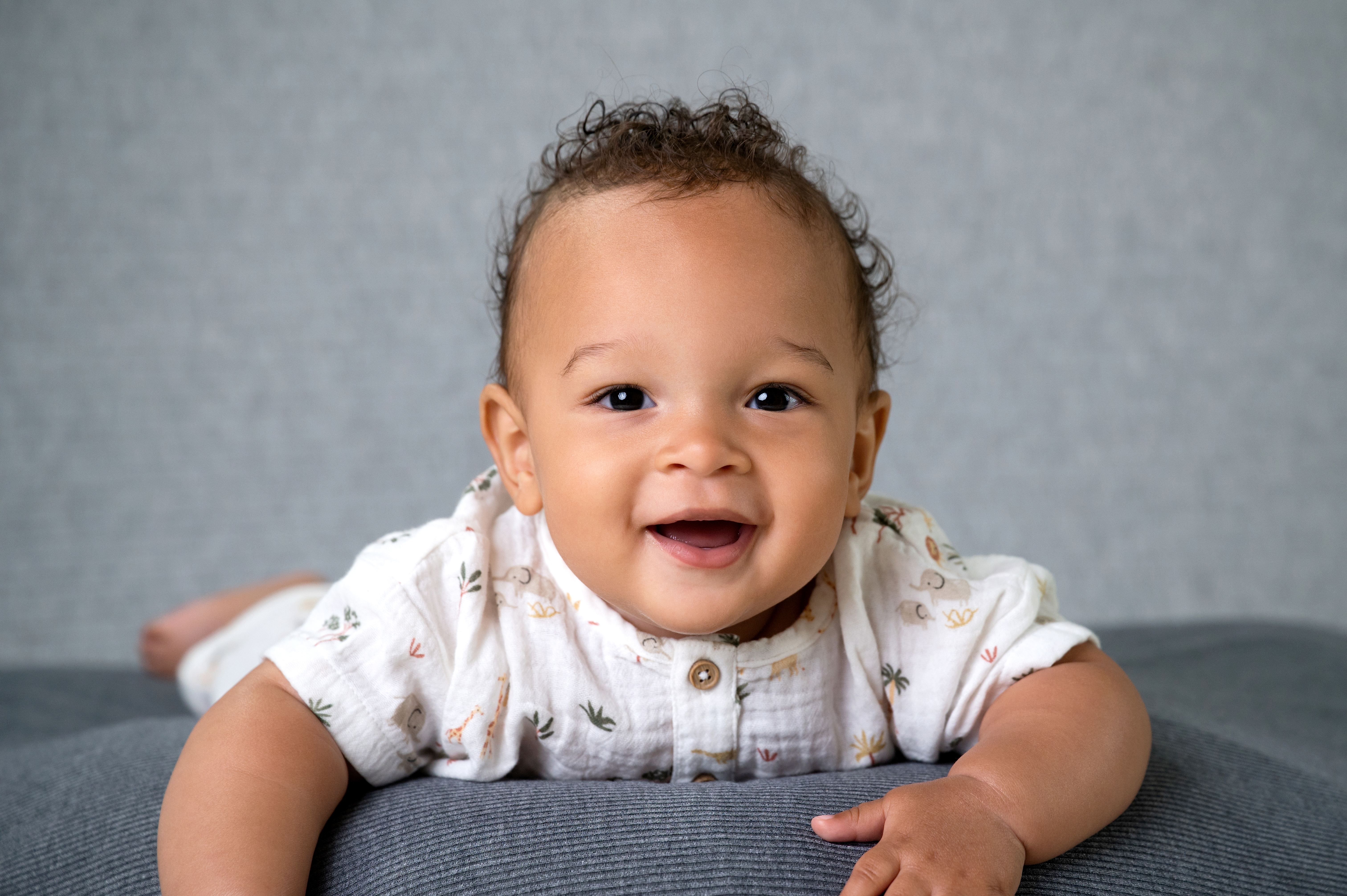 Happy sitting baby exploring their surroundings