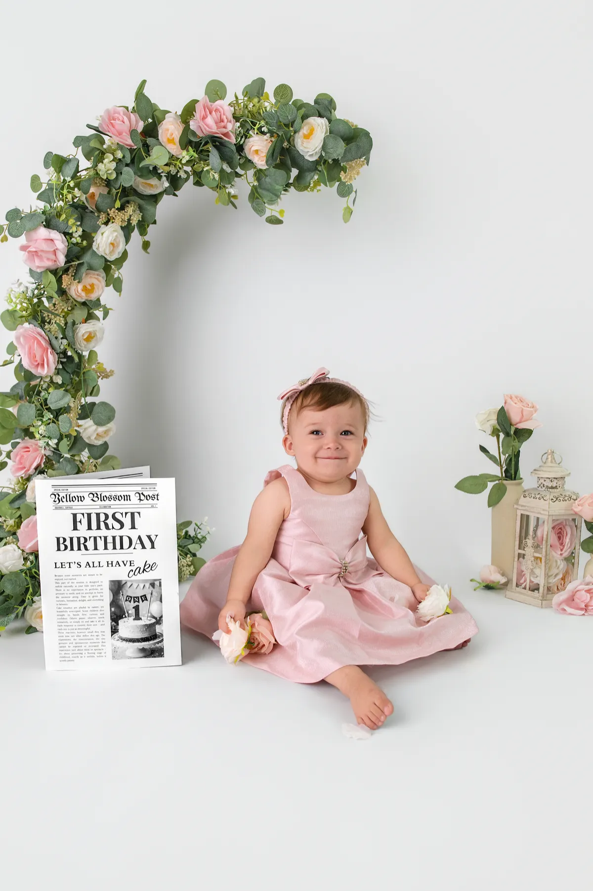 A sophisticated one-year-old birthday portrait featuring a simple neutral cake, embodying elegant and timeless photography.
