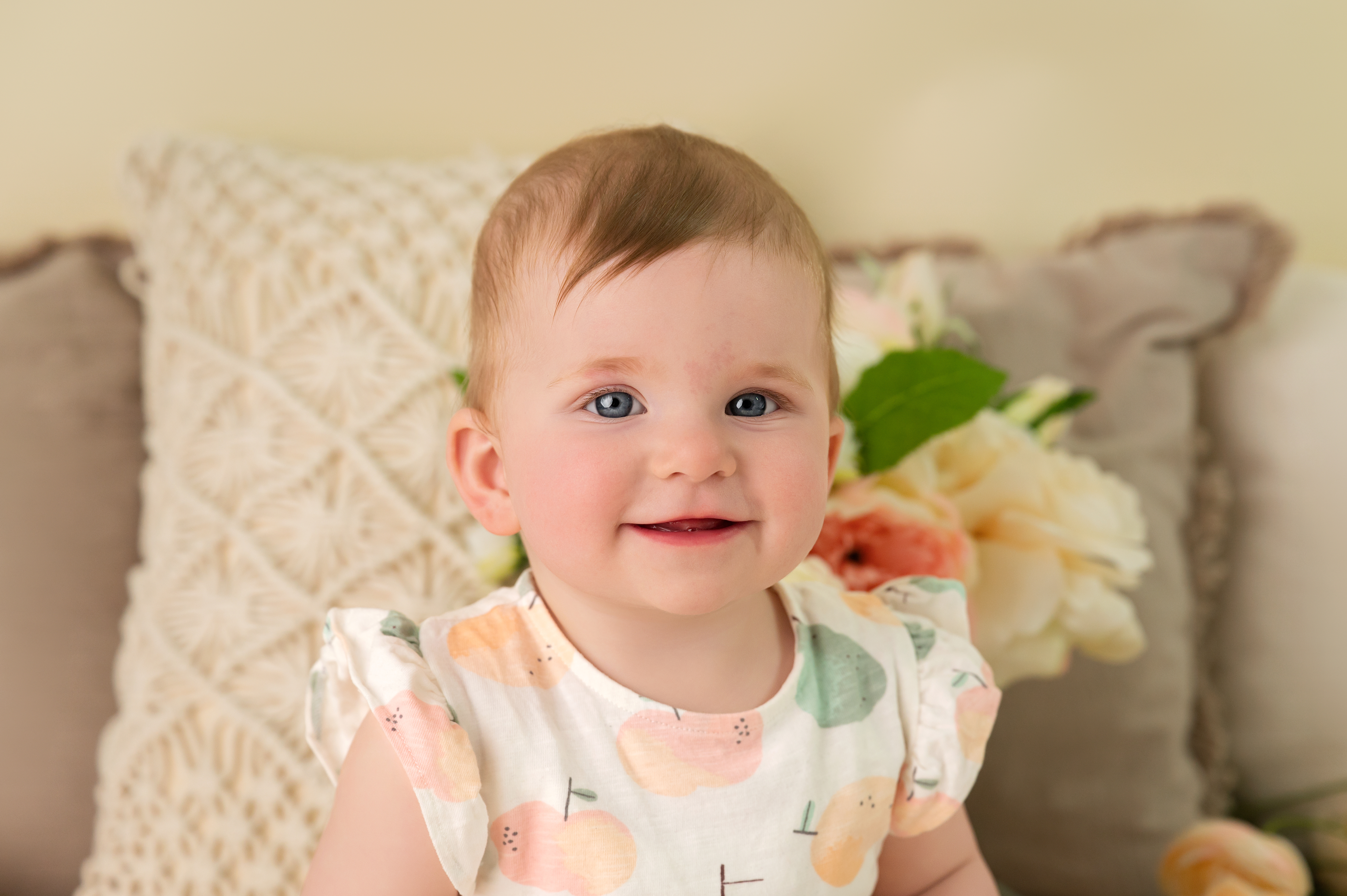 Joyful one year old baby with a beautiful birthday cake
