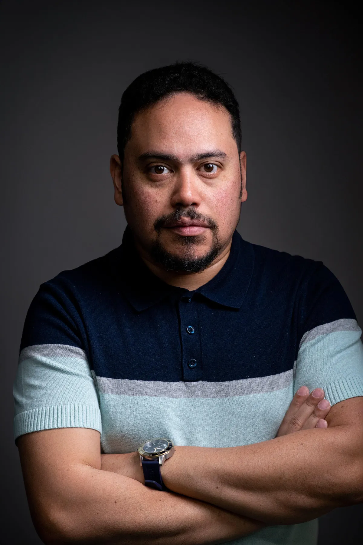 Headshot of video production manager, Eric Camacho