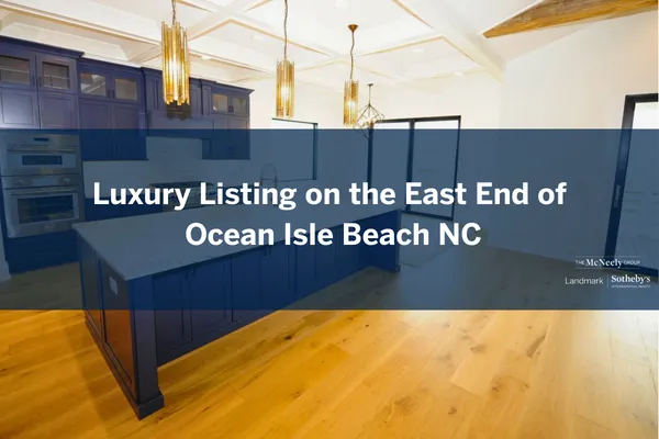 Gourmet kitchen with Thermador appliances, quartz island, stacked glass cabinets, and coffered ceiling in Ocean Isle Beach luxury home