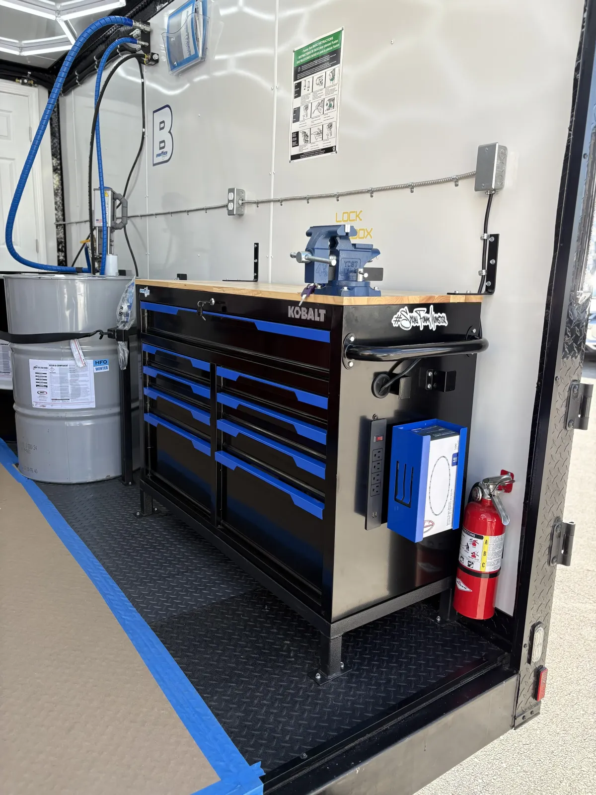 Workstation inside spray foam rig with Kobalt tool chest and safety gear by Spray Tech Services in Panama City, FL