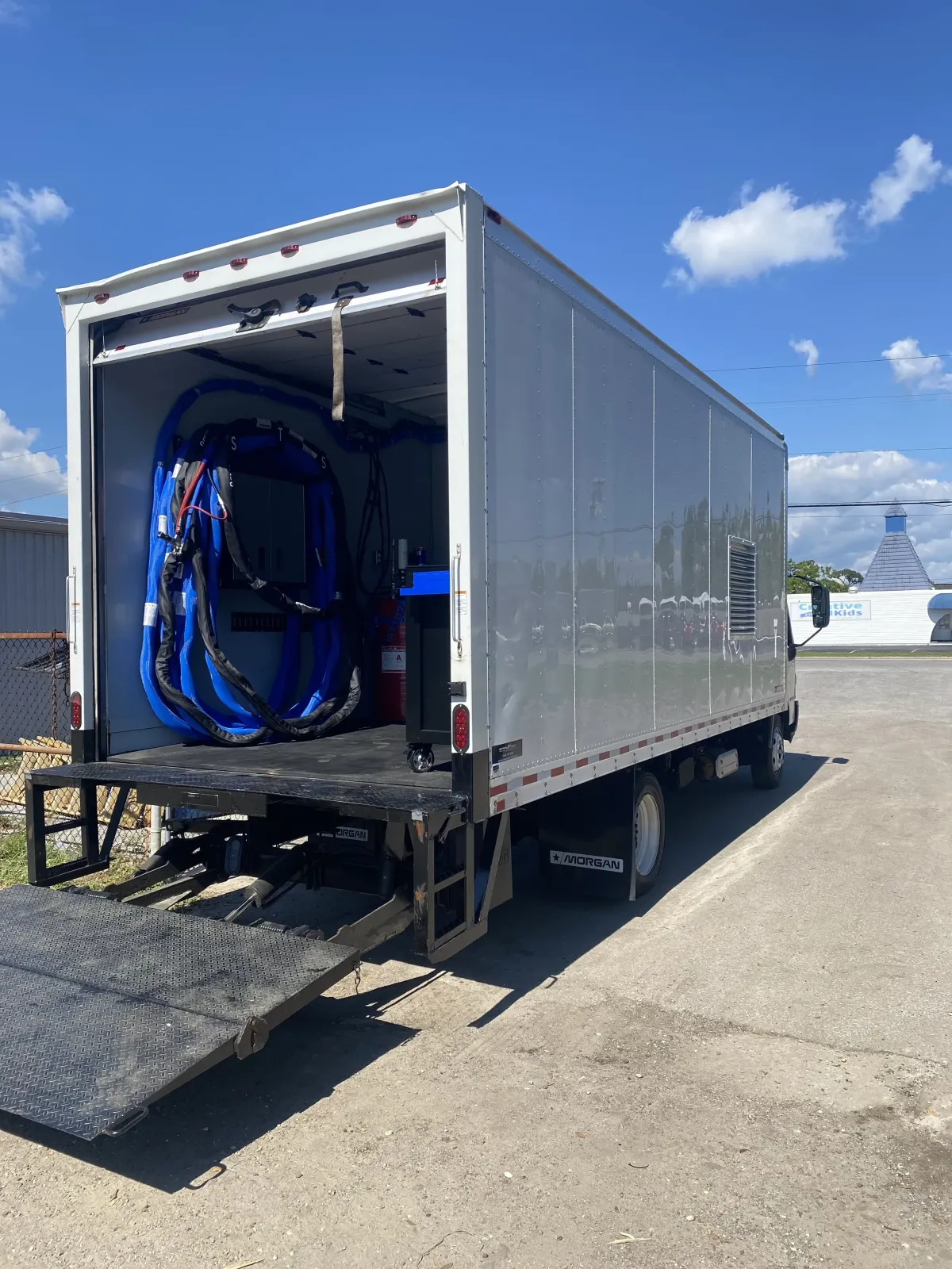 Custom spray foam box truck rig with installed hose system by Spray Tech Services in Panama City, FL