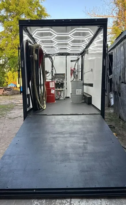 Completed spray foam rig with LED lighting, hose system, and drum setup by Spray Tech Services in Panama City, FL