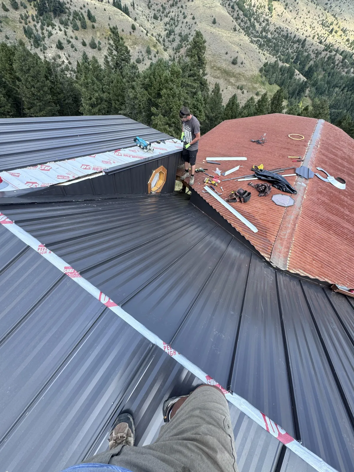 Flat commercial roof with new membrane, clean seams, and finished drainage scuppers.