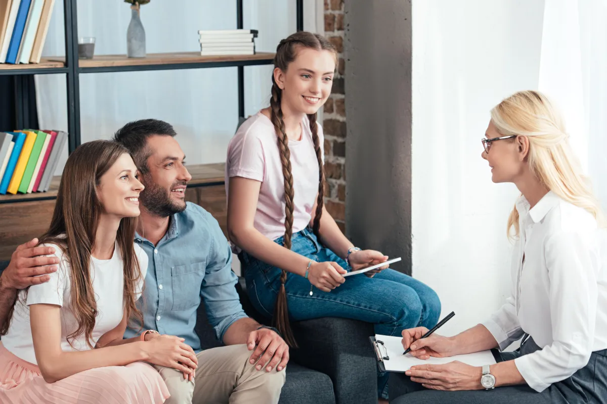 Compassionate therapist engaging in a supportive counseling session with a client
