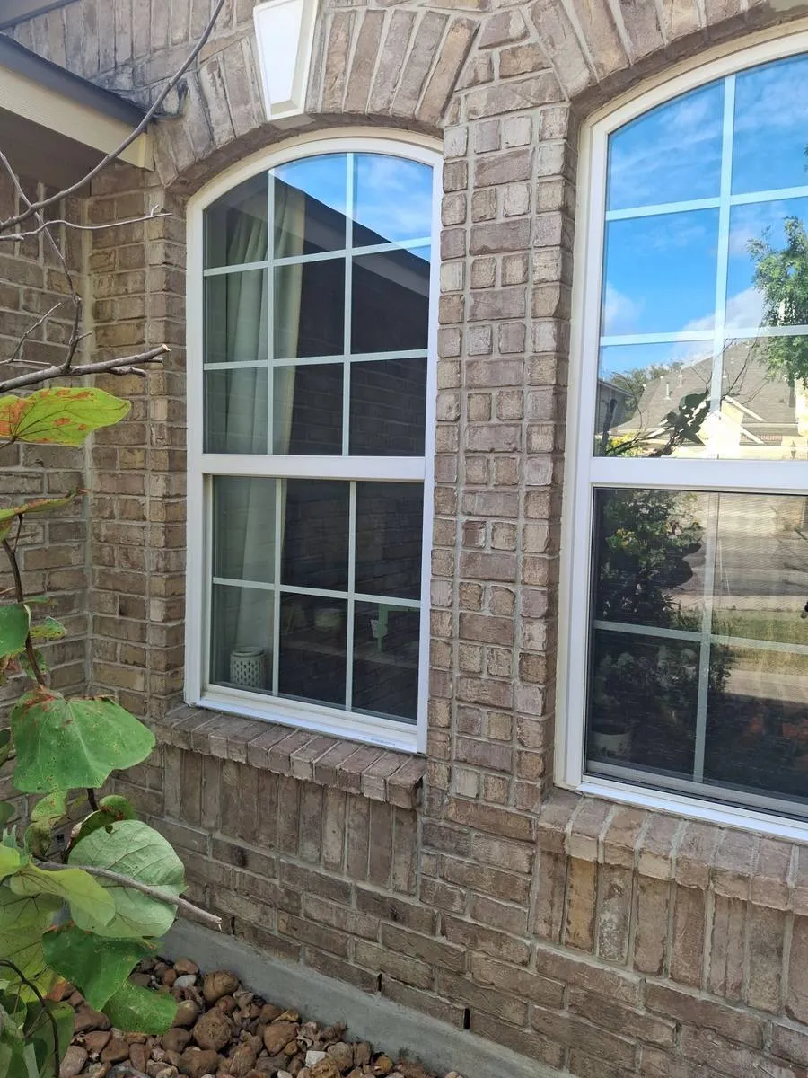 Completed arched window replacement on brick home