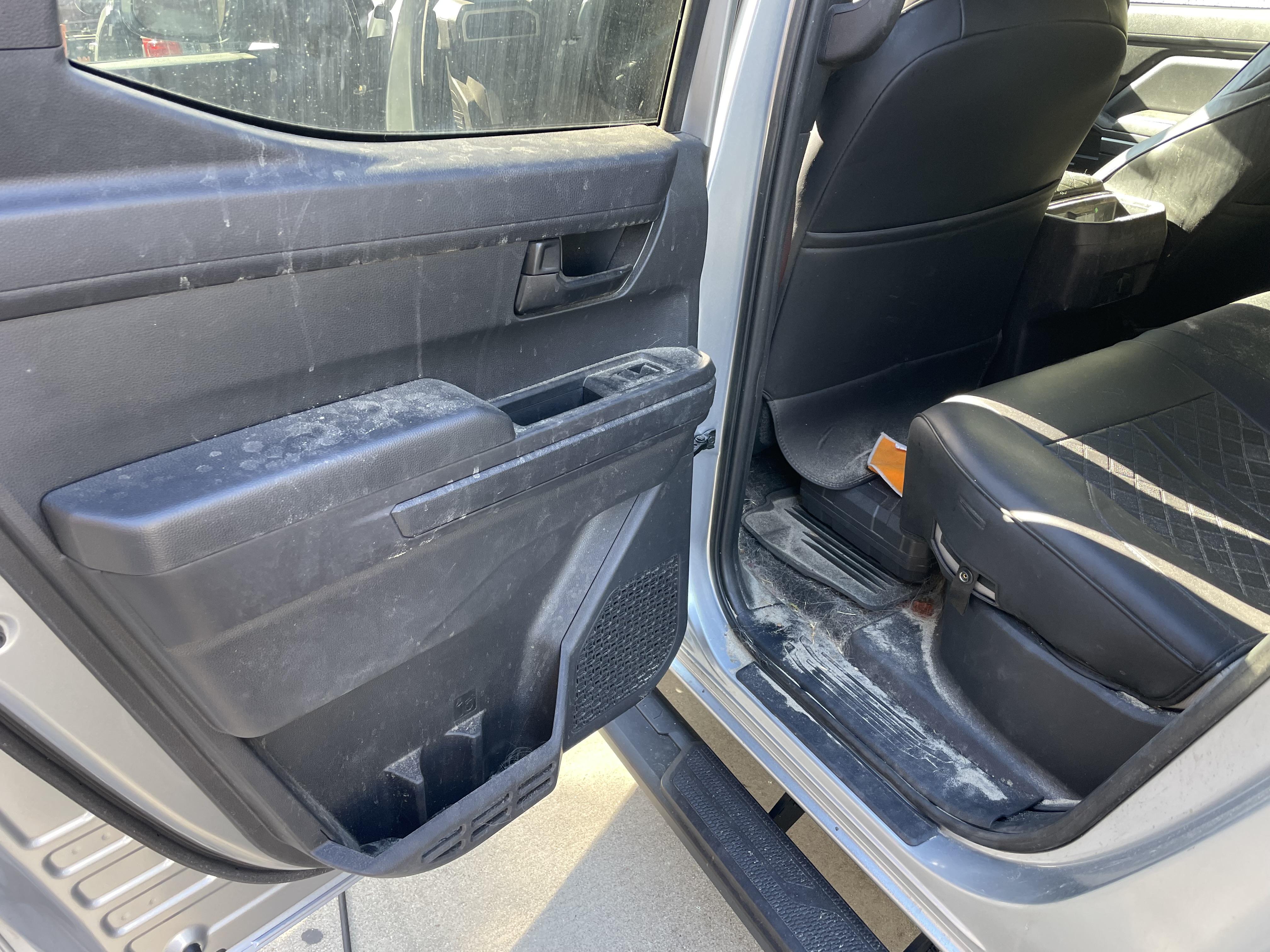 Vehicle door panel and interior showing areas where odor-causing contamination can collect