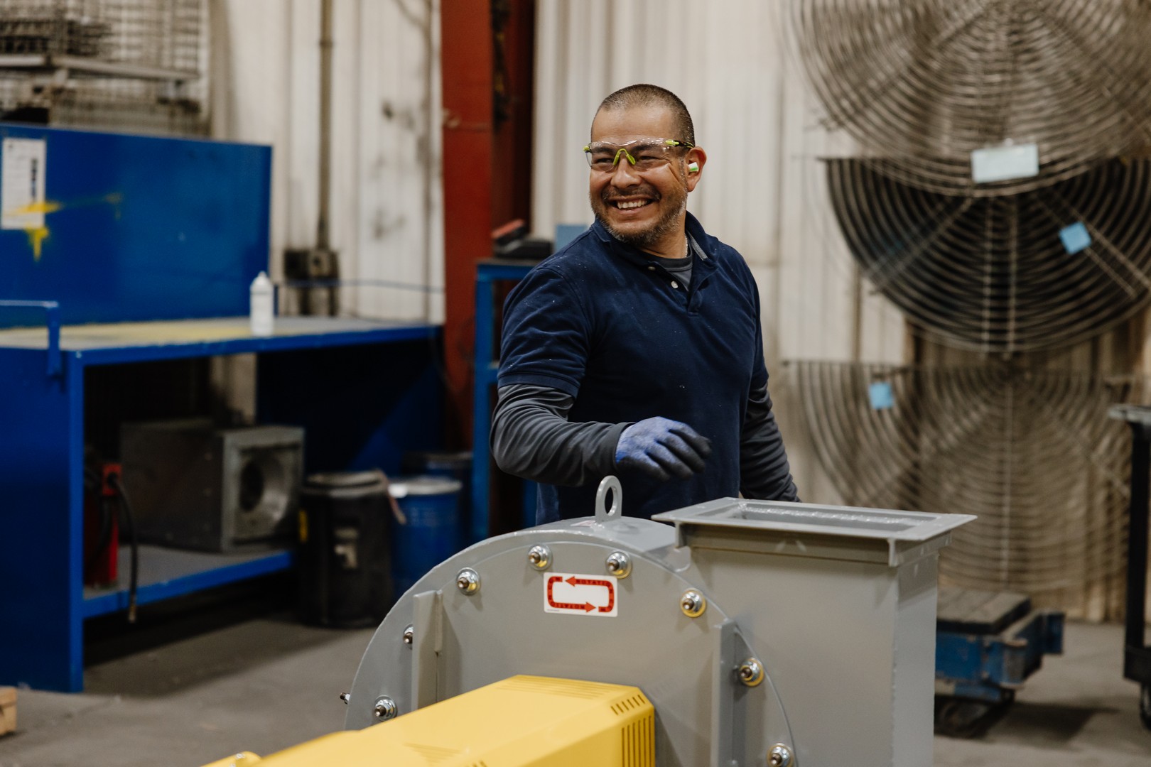 people sitting on chair in front of table while holding pens during daytime