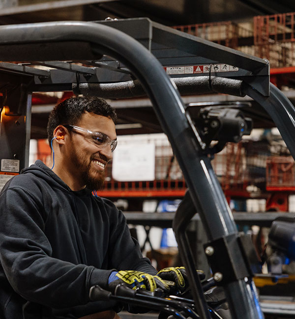 people sitting on chair in front of table while holding pens during daytime