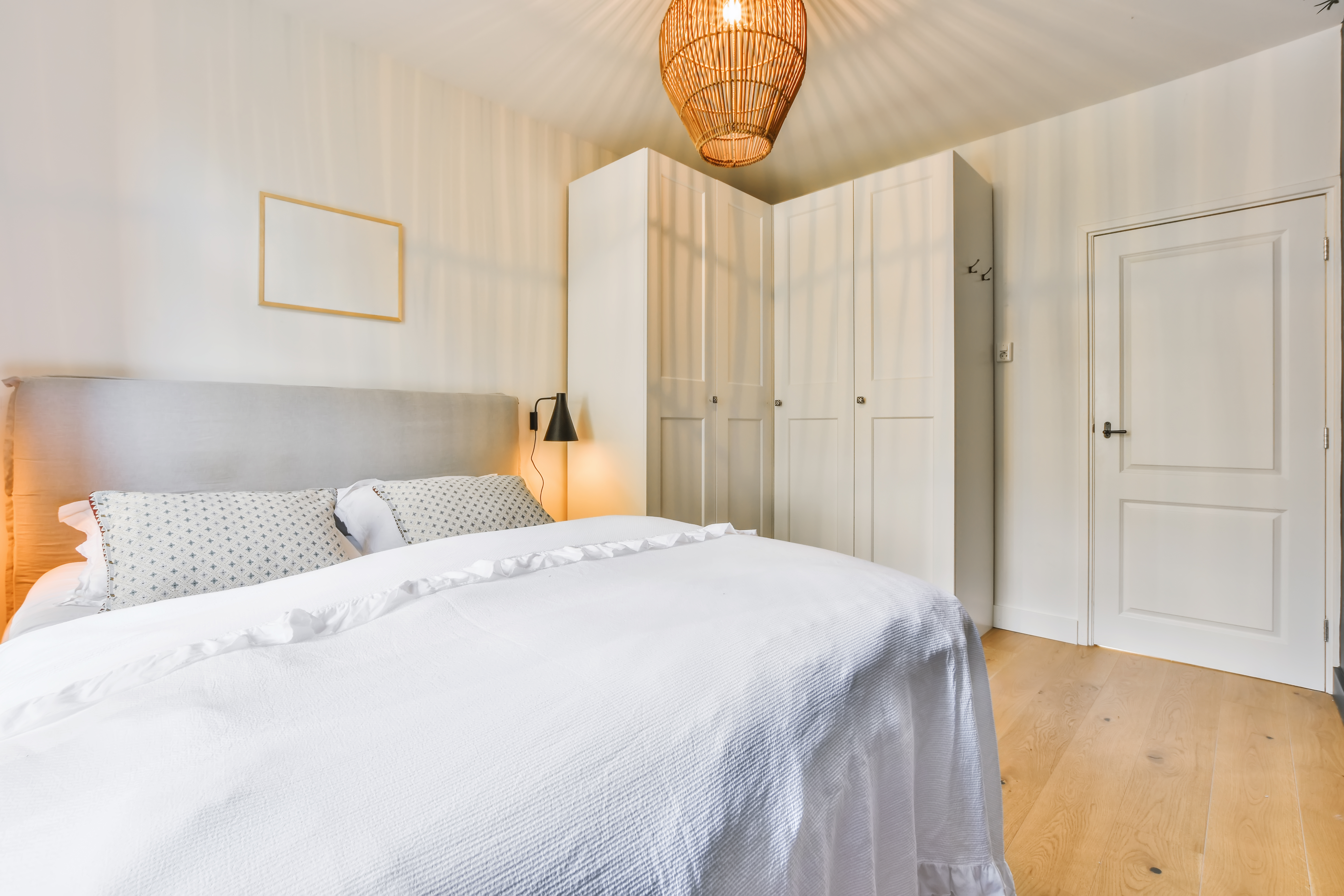 a small black car parked in a grassy field