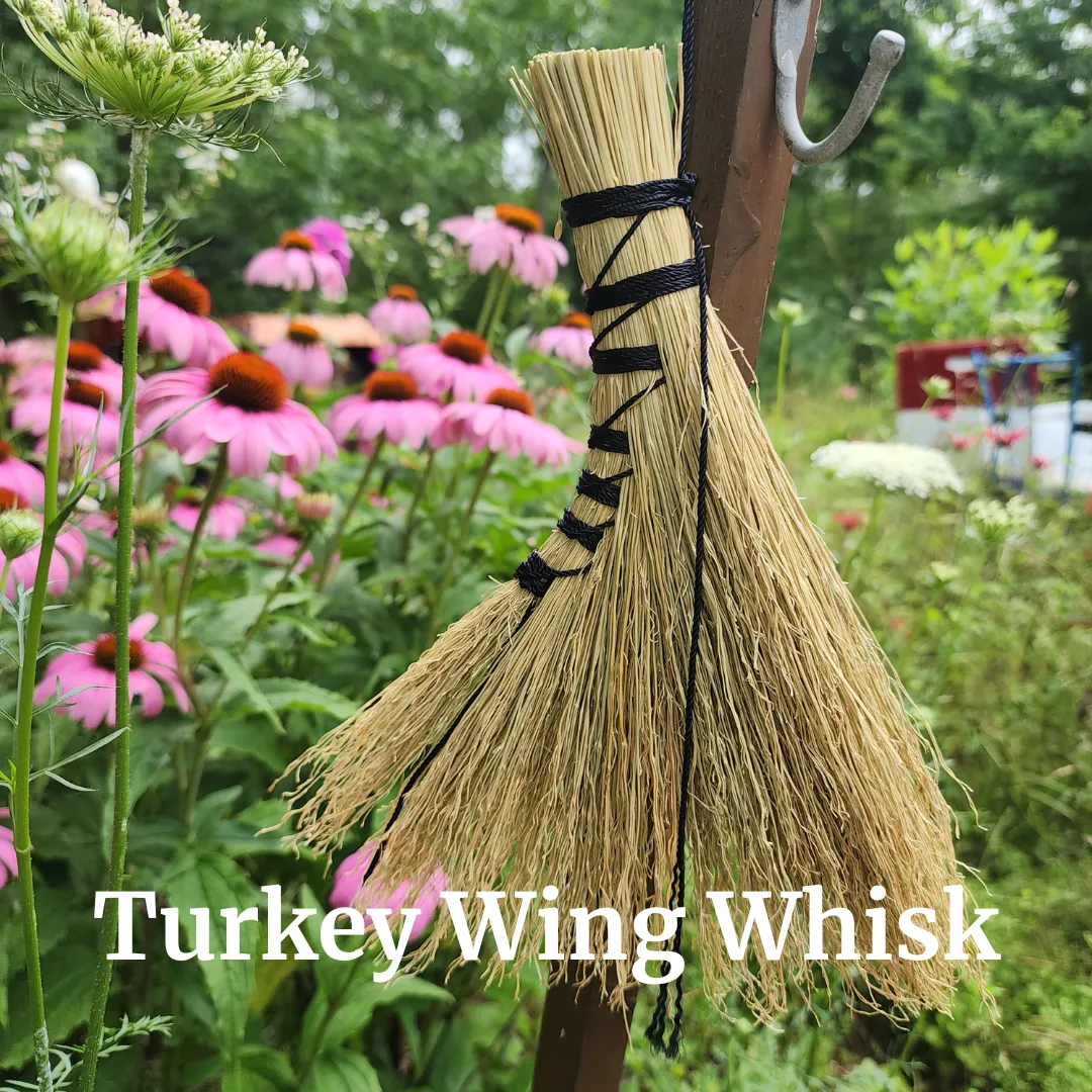 a metal cup with a spoon inside of it