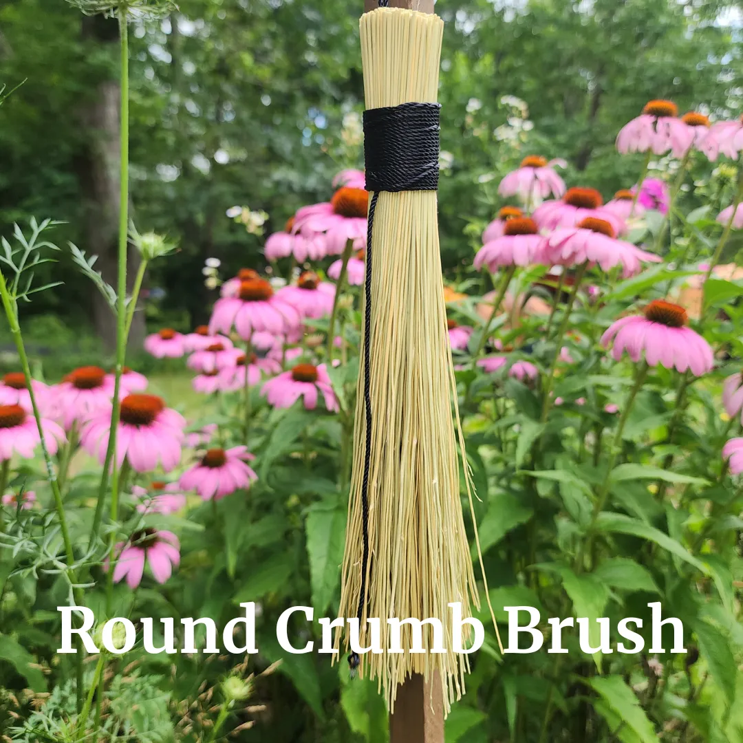 a metal cup with a spoon inside of it