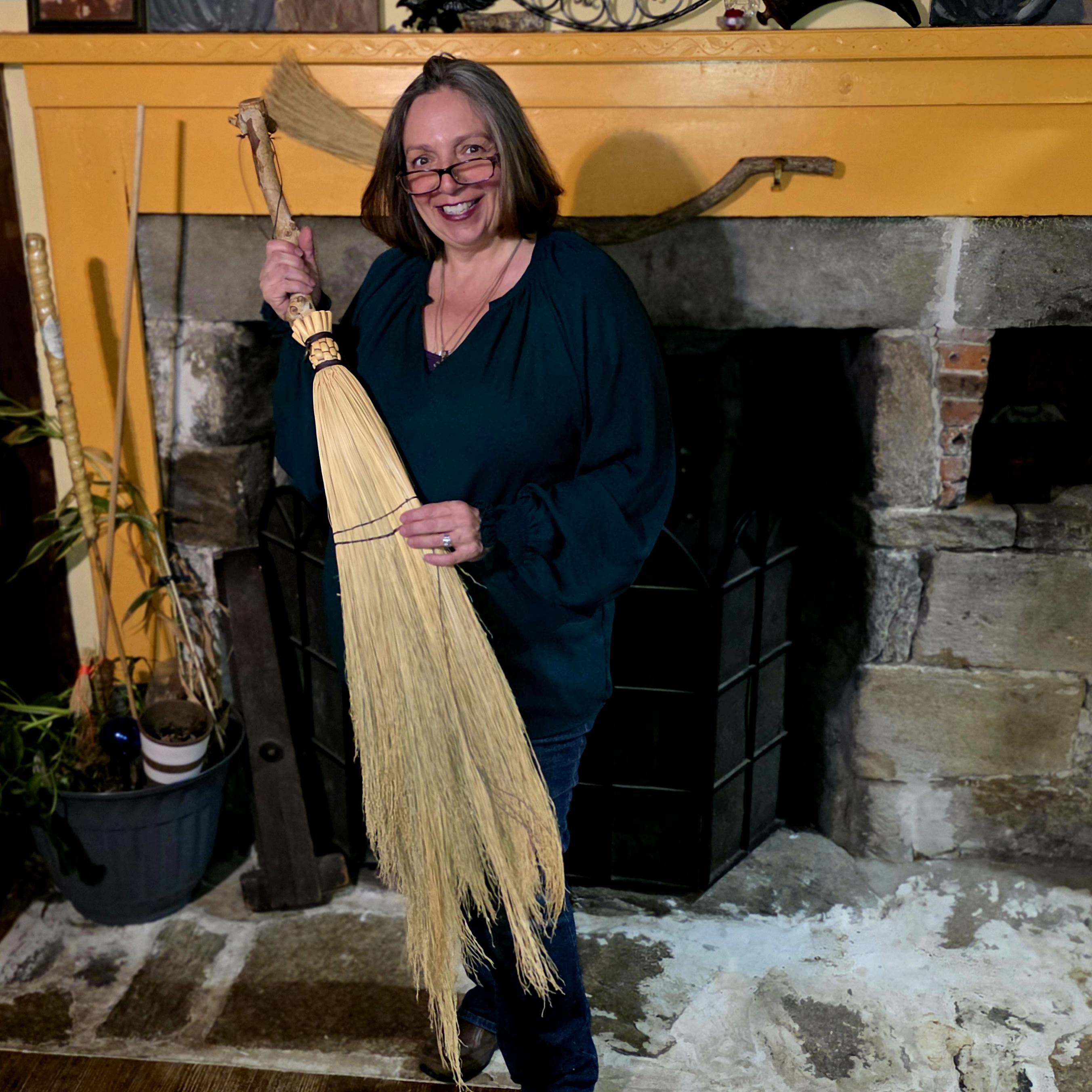 Founder of The Broom Witch Academy making a traditional broom
