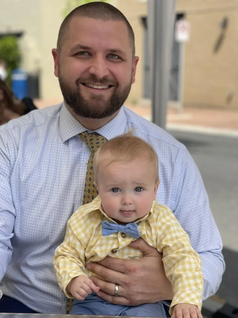 Stephen Hepburn with child, reflecting family values and trusted financial advising at Drexel & Co. Financial Planning in Bel Air, Maryland