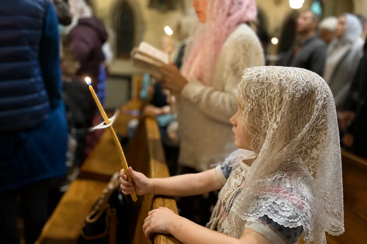 Catholic family participating in church service, reflecting faith, values, and family-centered financial planning with Drexel & Co. Financial Planning in Maryland