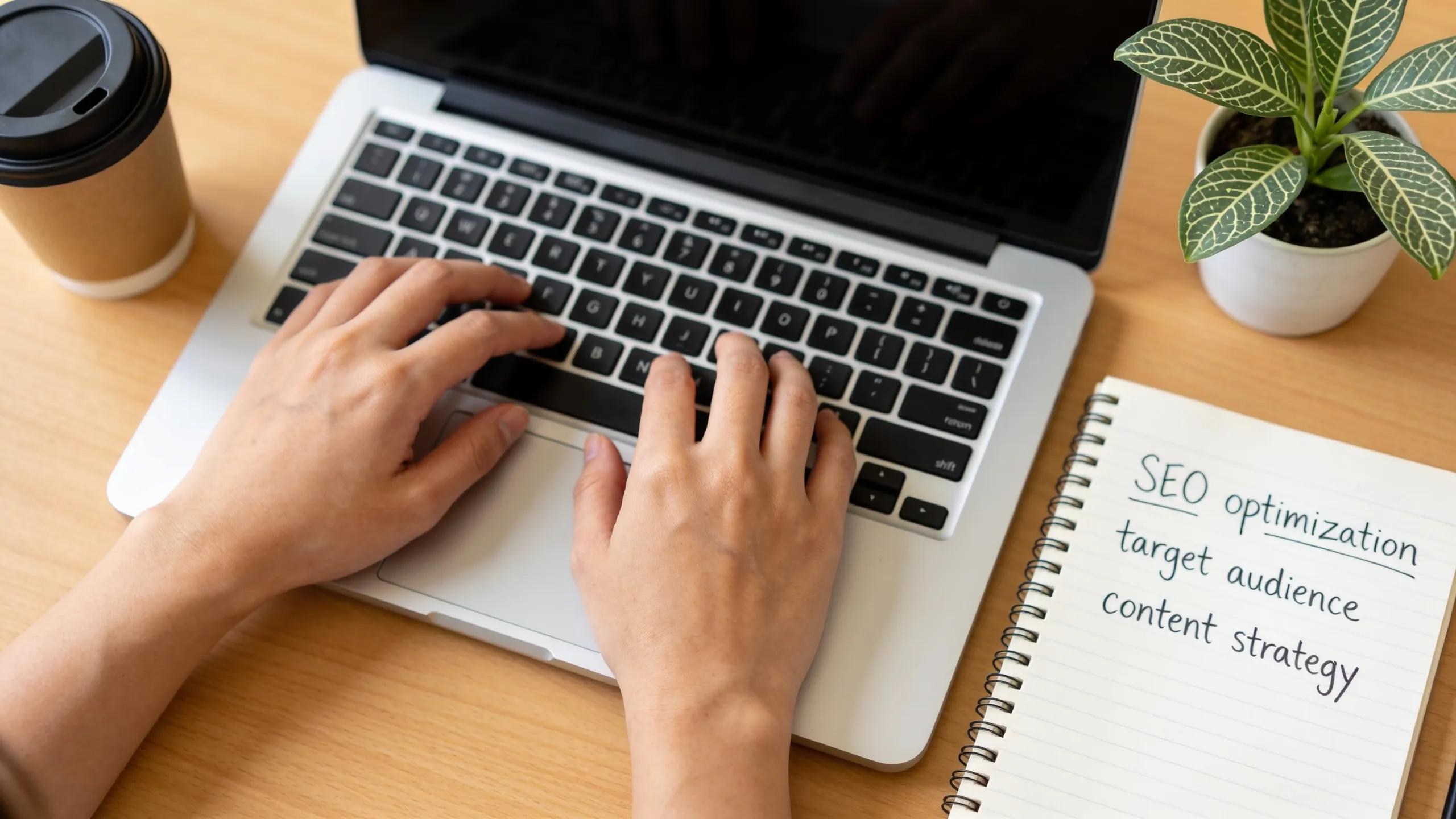 hands typing on a laptop