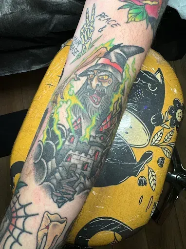 Retro flower tattoo with orange and green palette