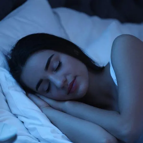 Woman Sleeping on Camp Bed