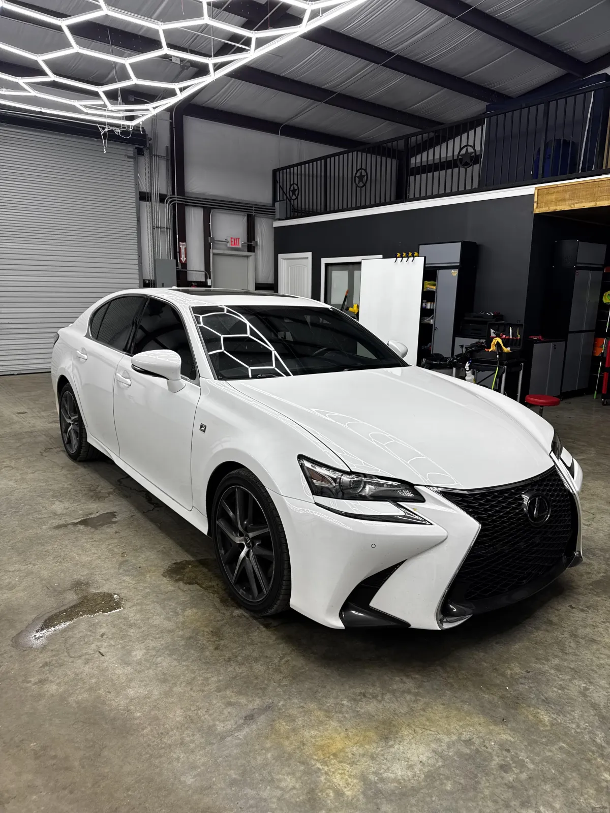 White Lexus inside the Prestige Auto Styling shop