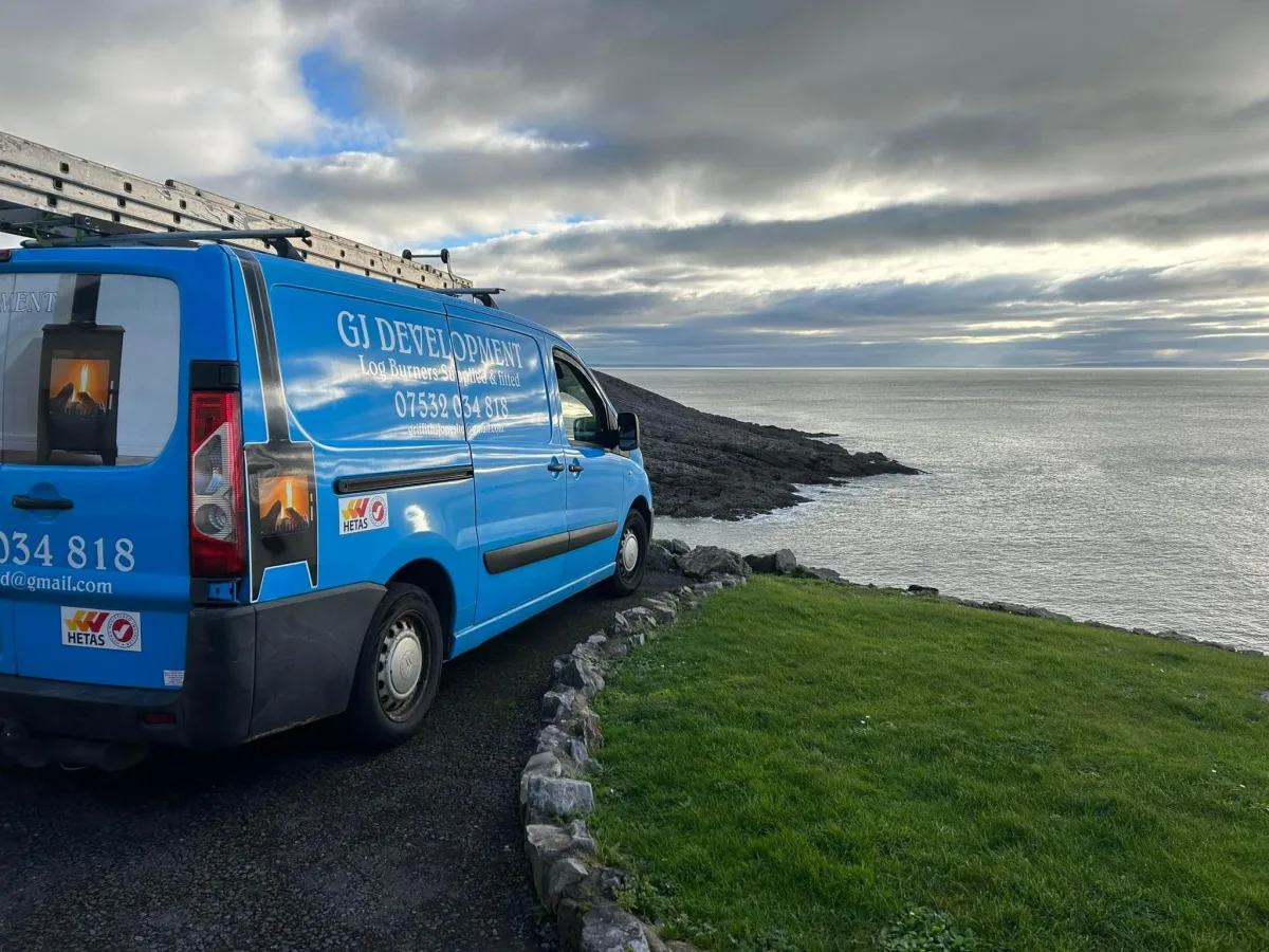 a room with a stove and a chair in it