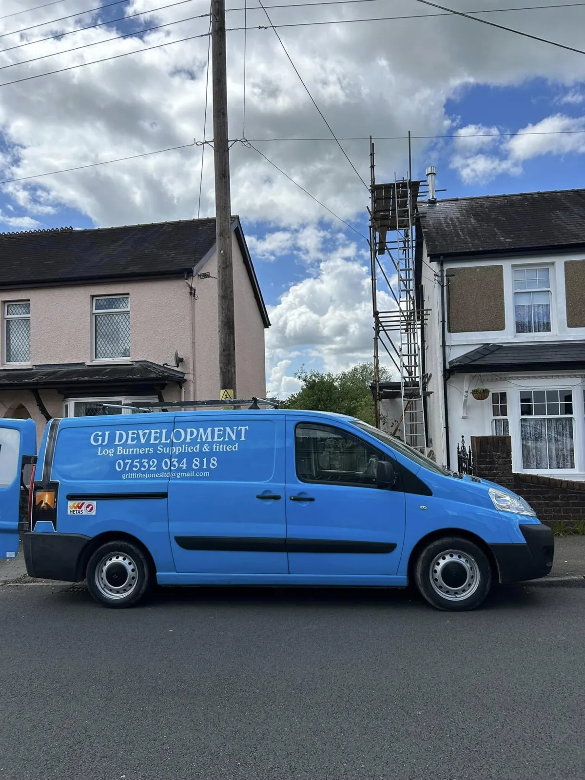 a living room with two chairs and a fire place