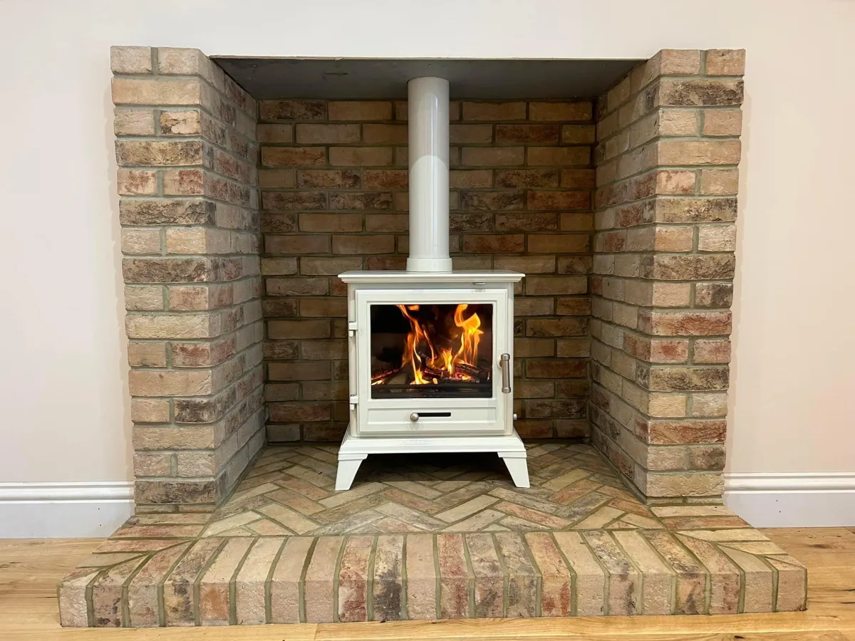 a living room filled with furniture and a fire place