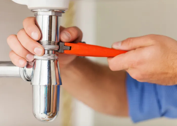 a close up of a water faucet attached to a wall