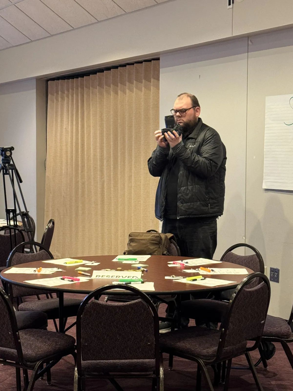 Chase Imkan media specialist filming at leadership training event