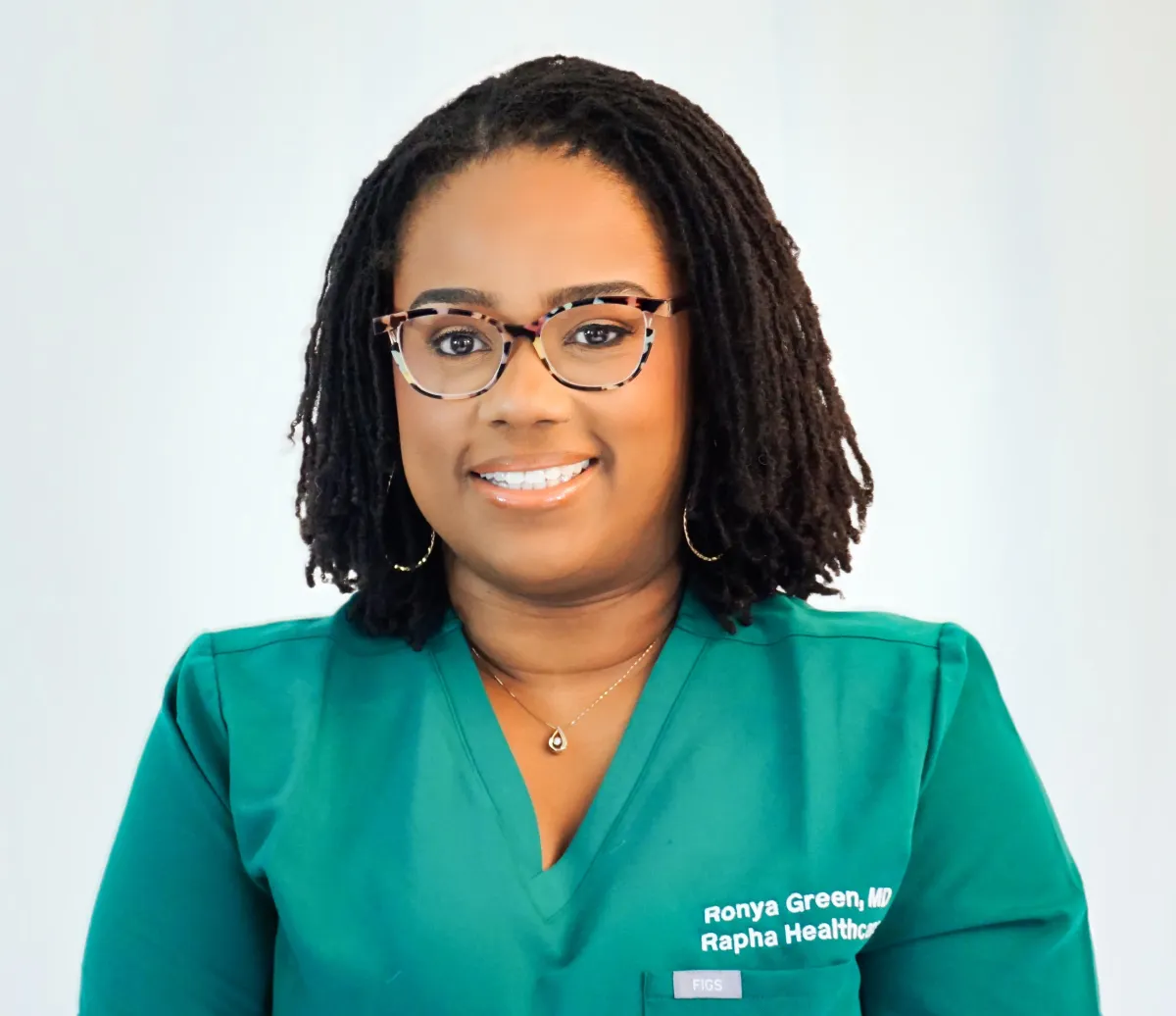 Editorial headshot of Dr. Ronya Green in a warm, inviting setting