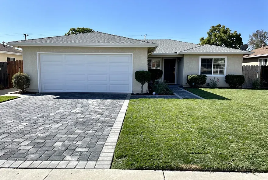 Paver driveway connected to garage of a home in Rosemead, California on a sunny day