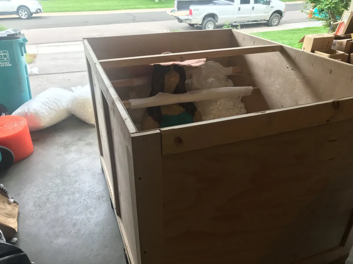 Professional Fort Collins movers carefully wrapping furniture before a residential move
