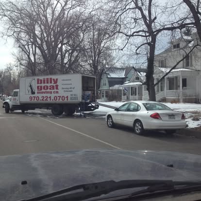Moving truck parked outside a Fort Collins home during peak moving season
