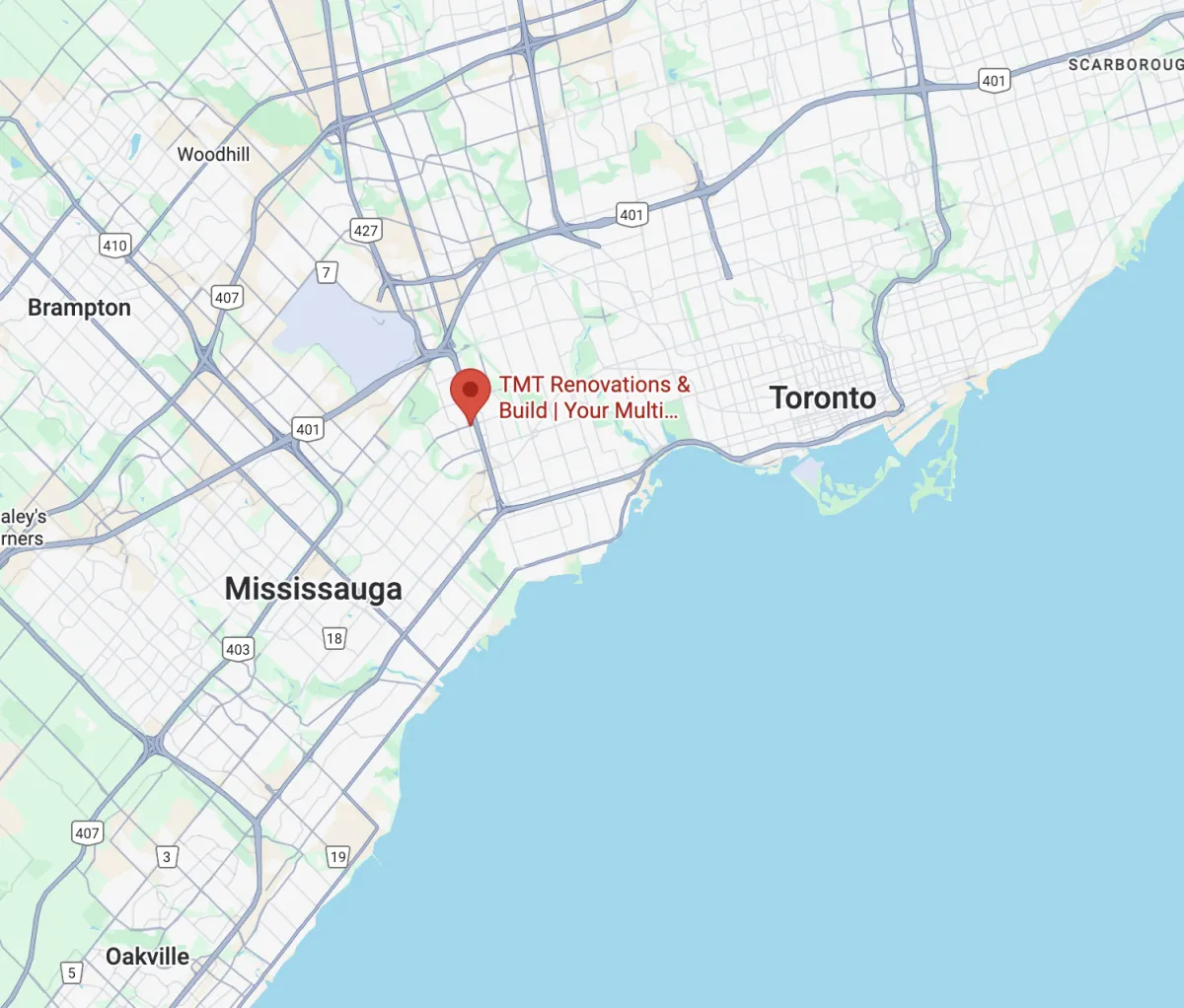 a bathroom with a toilet, sink, shower and mirror